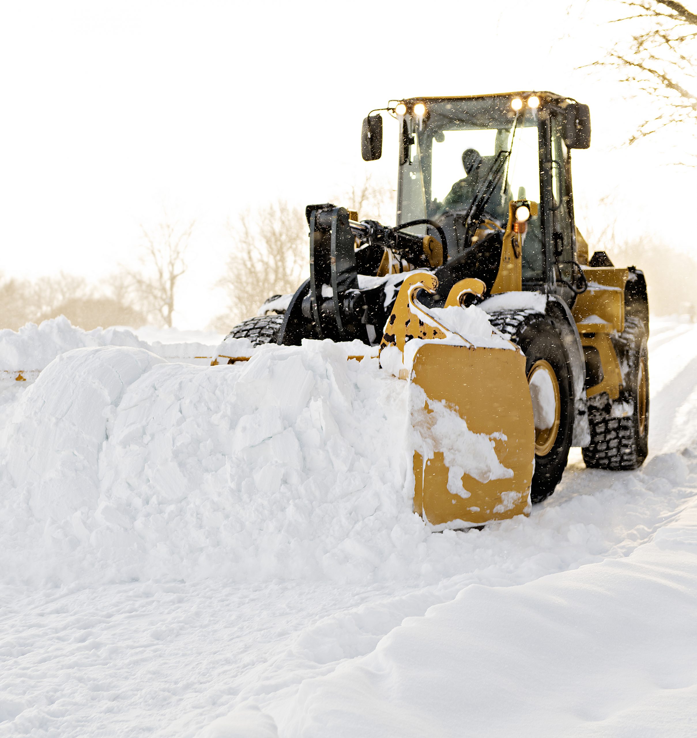 Wheel Loader Removing Snow With Snow Pusher